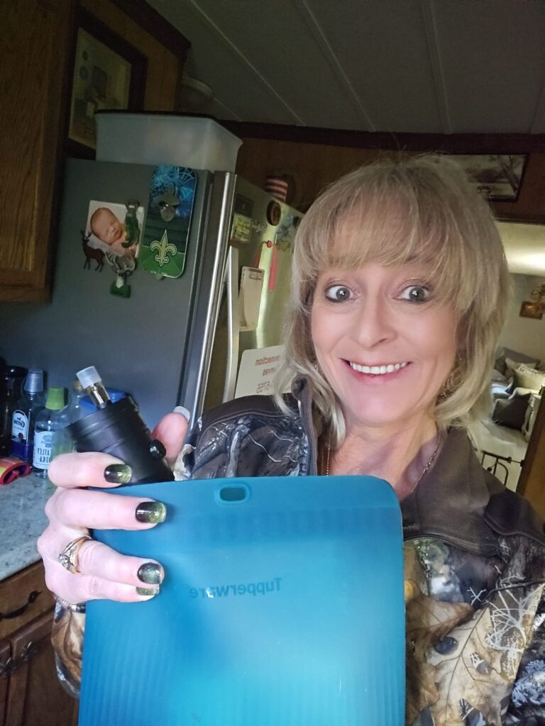Lisa showing off her new Doe Scent Misting device she keeps stored in a silicone bag