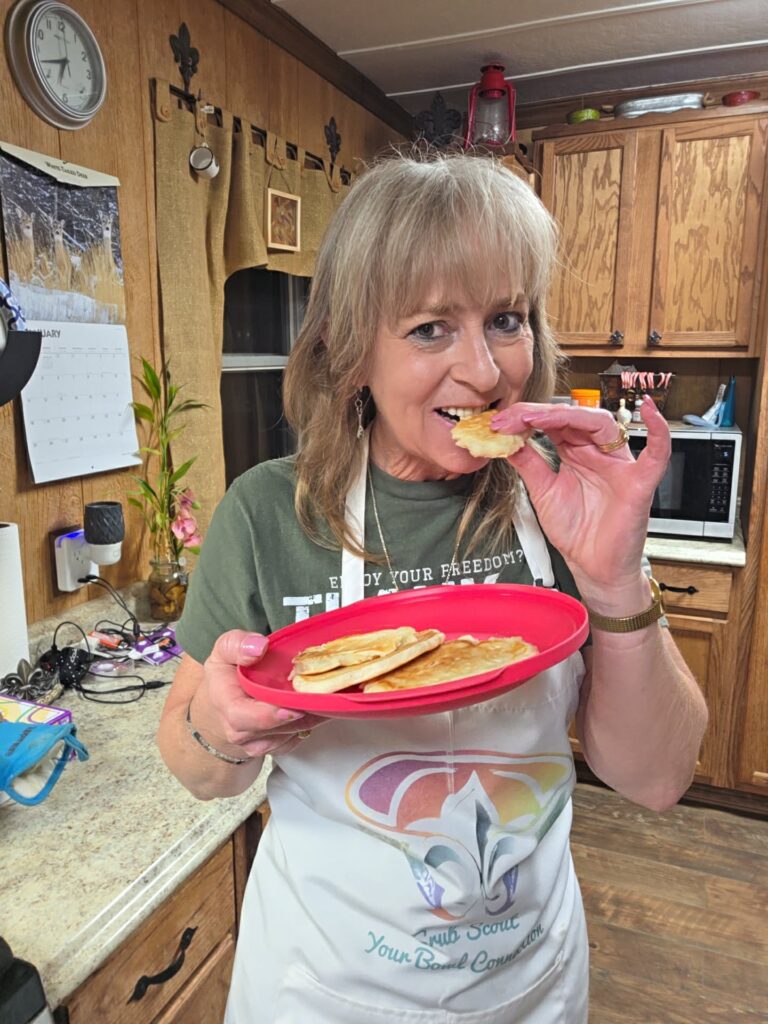 Lisa Cuevas taking a bite of her 10-minute homemade flatbread in her kitchen.