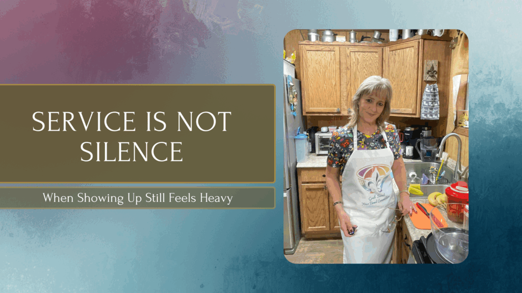 Lisa standing in her real-life kitchen wearing an apron, reflecting a calm but honest moment of service and caregiving, representing the Chaos to Cozy Kitchen System™ and steady kitchen rhythms