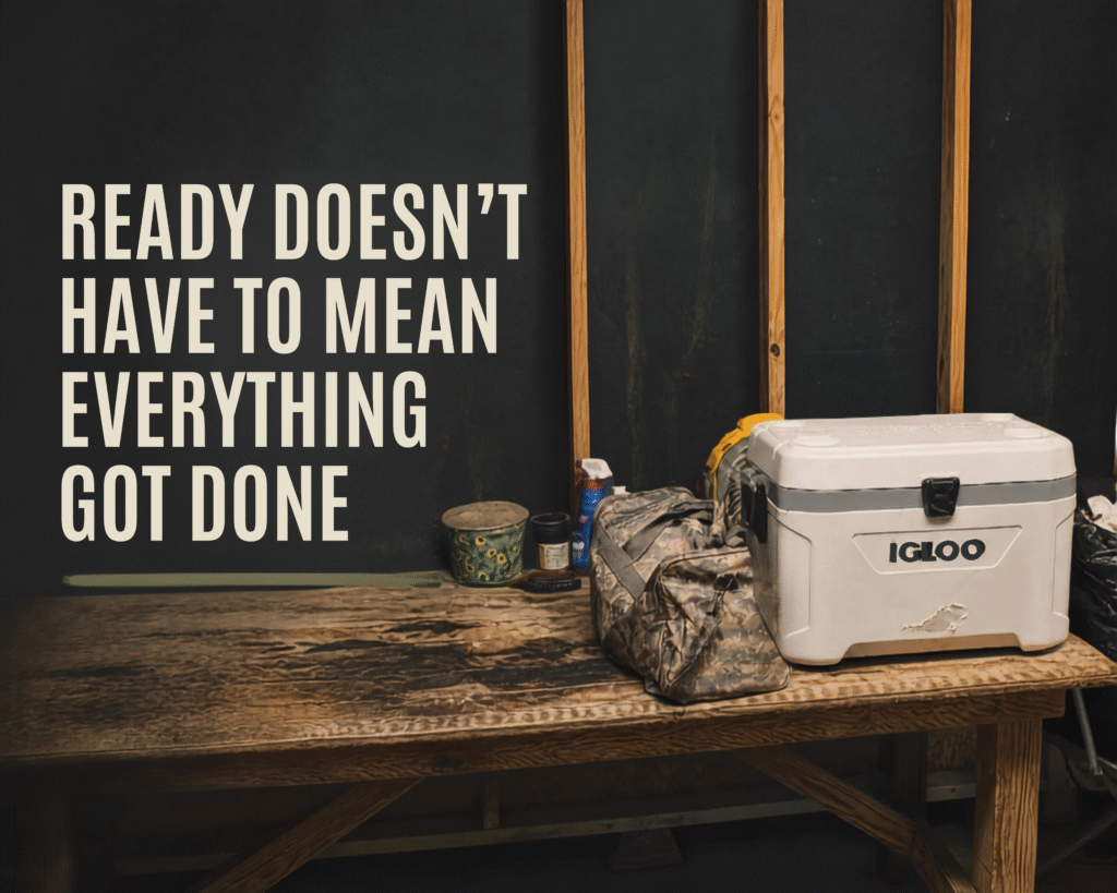 Ice chest and travel essentials gathered on a well-used table the night before a Louisiana road trip.